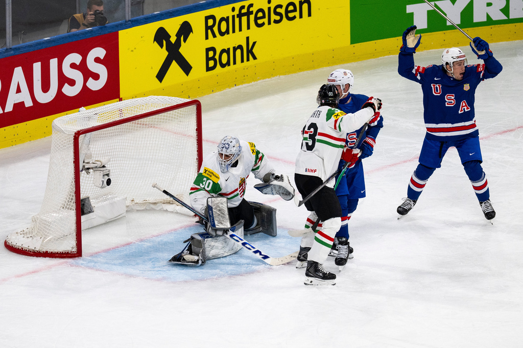 Ryan Leonard of the U.S., right, celebrates after his side's first goal of the game during the 2026 IIHF Men's Ice Hockey World Championship preliminary round group A game between United States and Hungary, in Zurich, Switzerland, Monday, May 25, 2026. (Andreas Becker/Keystone via AP)