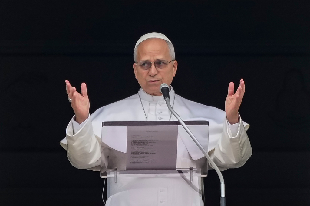 Pope Leo XIV appears at the window of his studio overlooking St. Peter's Square at the Vatican where Catholic faithful and pilgrims gathered for the traditional Sunday blessing at the end of the noon Angelus prayer, Sunday, March 15, 2026. (AP Photo/Andrew Medichini)