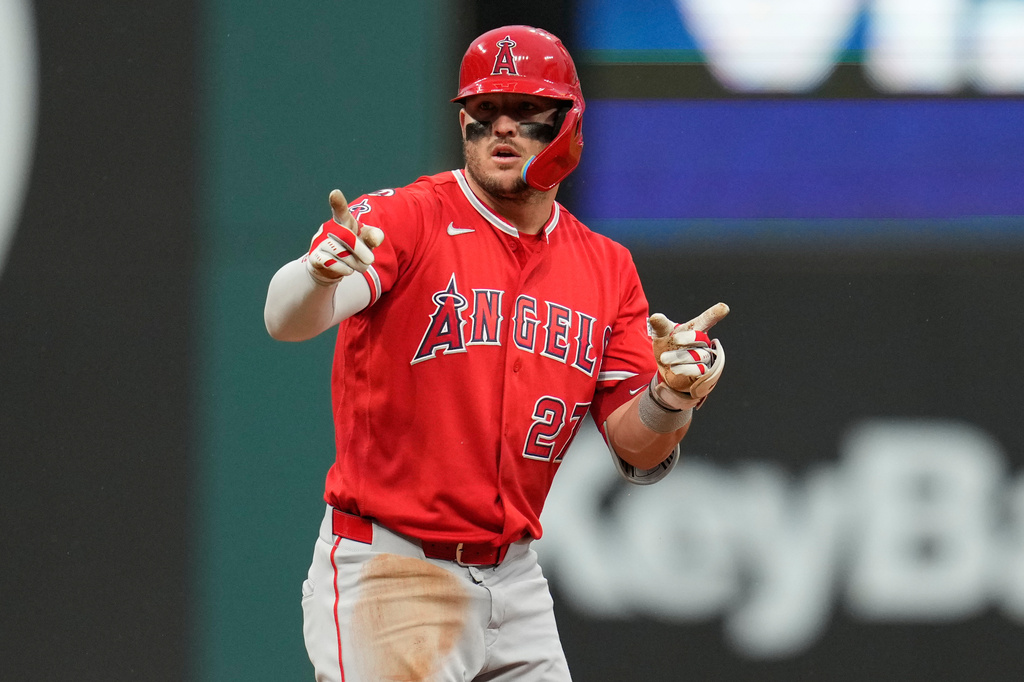 Los Angeles Angels' Mike Trout gestures from second base after hitting a double in the fifth inning of a baseball game against the Cleveland Guardians in Cleveland, Tuesday, May 12, 2026. (AP Photo/Sue Ogrocki)