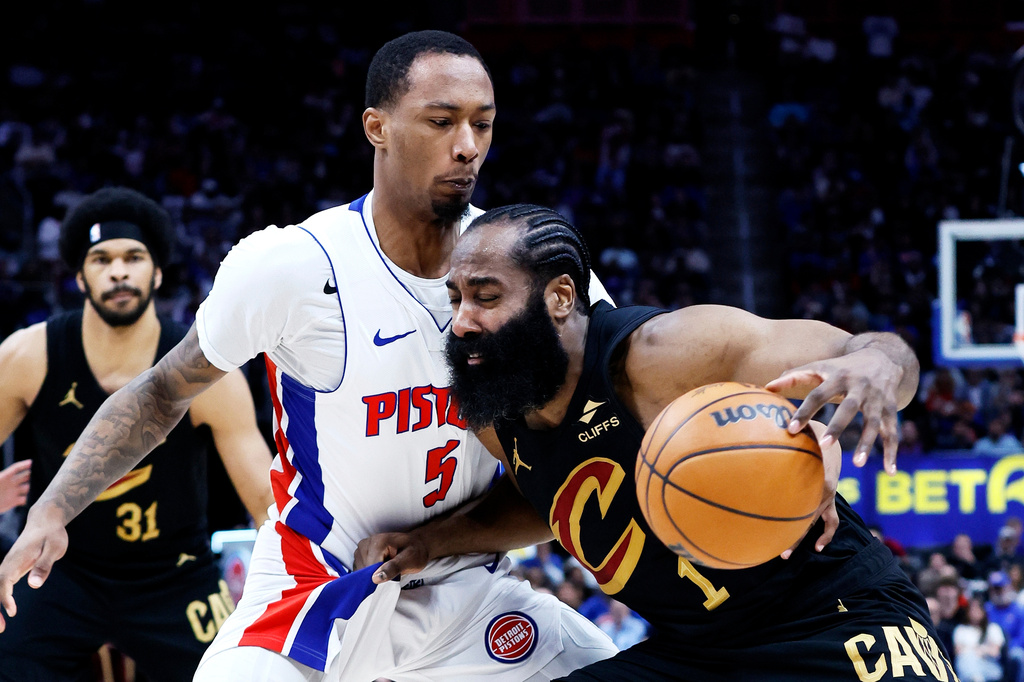 Cleveland Cavaliers guard James Harden (1) drives against Detroit Pistons forward Ronald Holland II (5) during the first half in Game 2 of a second-round NBA playoffs basketball series, Thursday, May 7, 2026, in Detroit. (AP Photo/Duane Burleson)