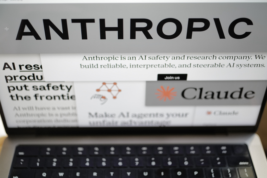 FILE - Pages from the Anthropic website and the company's logos are displayed on a computer screen in New York on Thursday, Feb. 26, 2026. (AP Photo/Patrick Sison, File)
