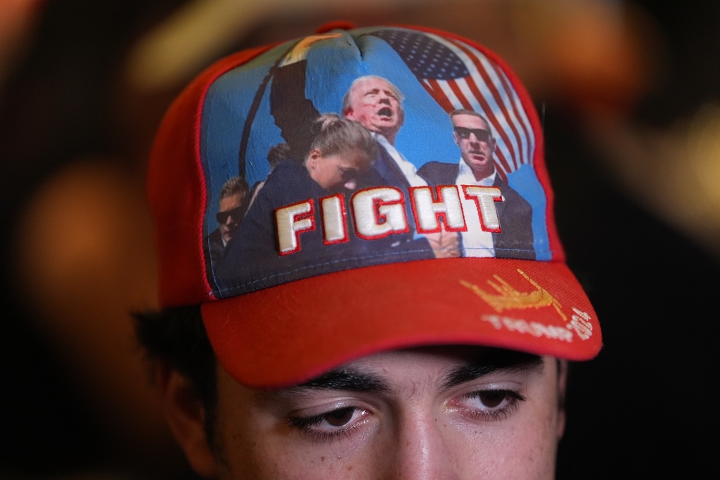 A supporter wears a President Donald Trump hat at New Jersey Republican gubernatorial candidate Jack Ciattarelli's election night gathering, Tuesday, Nov. 4, 2025, in Bridgewater, N.J. (AP Photo/Matt Slocum)