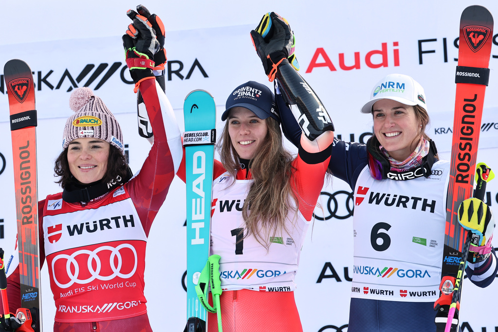 Switzerland's Camille Rast, center, winner of an alpine ski, women's World Cup giant slalom, poses on the podium with second placed Austria's Julia Scheib, left, and third placed United States' Paula Moltzan in Kranjska Gora, Slovenia, Saturday, Jan. 3, 2026. (AP Photo/Marco Trovati)