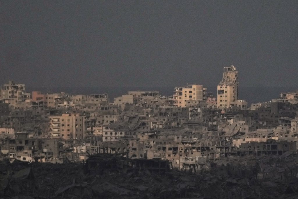 Buildings that were destroyed during the Israeli ground and air operations stand in the northern Gaza Strip, as seen from southern Israel, Thursday, Oct. 9, 2025, following the announcement that Israel and Hamas have agreed to the first phase of a peace plan to pause the fighting. (AP Photo/Ariel Schalit)