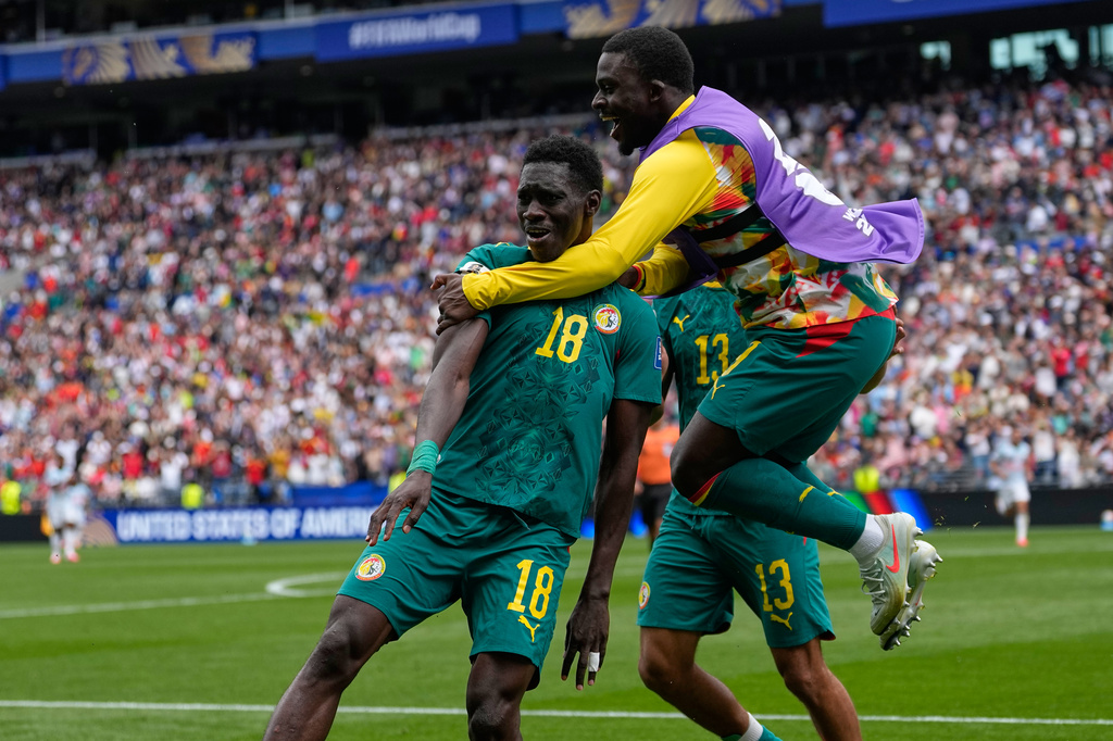 Senegal's Ismaila Sarr (18) is congratulated after scoring his side's 2nd goal during the World Cup round of 32 soccer match between Belgium and Senegal in Seattle, Wednesday, July 1, 2026. (AP Photo/Lindsey Wasson)