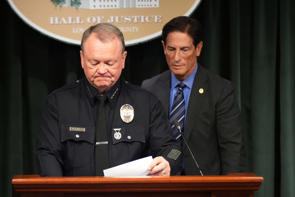 LAPD Chief Jim McDonnell, left, and Los Angeles District Attorney Nathan Hochman announce developments about the murder case of Rob Reiner and his wife Michele Tuesday, Dec. 16, 2025, in Los Angeles. (AP Photo/Damian Dovarganes)