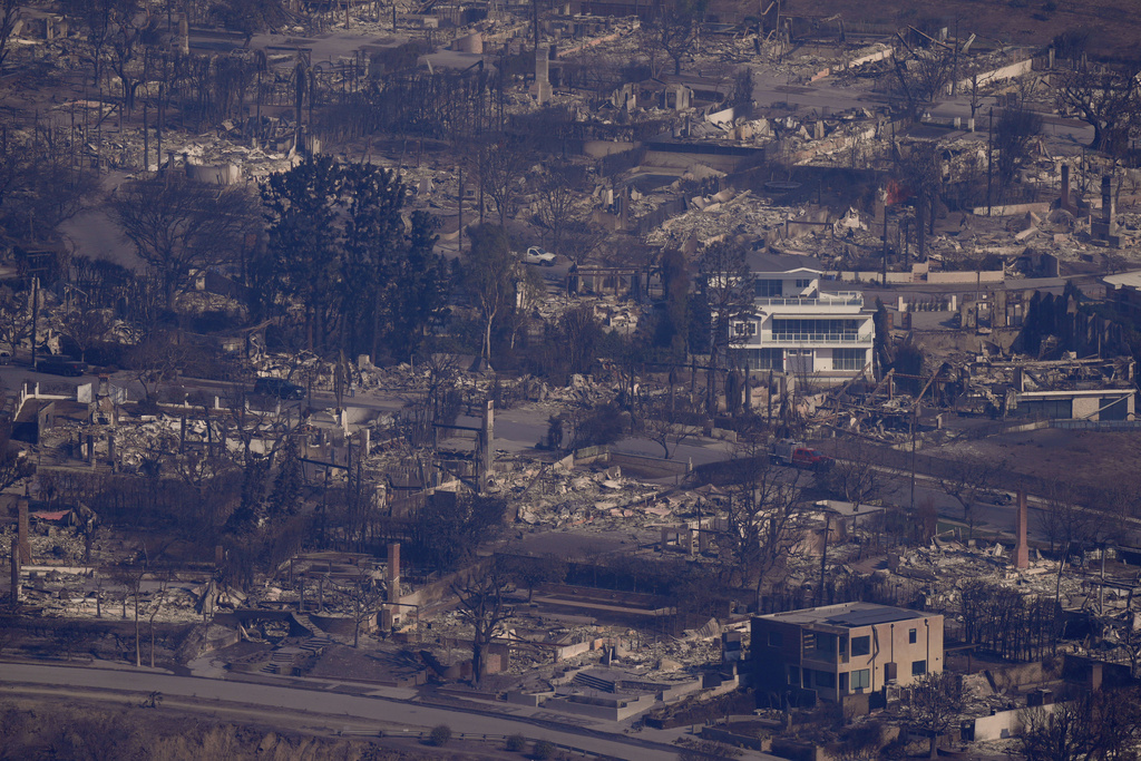 The devastation from the Palisades Fire is seen from the air in the Pacific Palisades neighborhood of Los Angeles, Thursday, Jan. 9, 2025. (AP Photo/Mark J. Terrill)