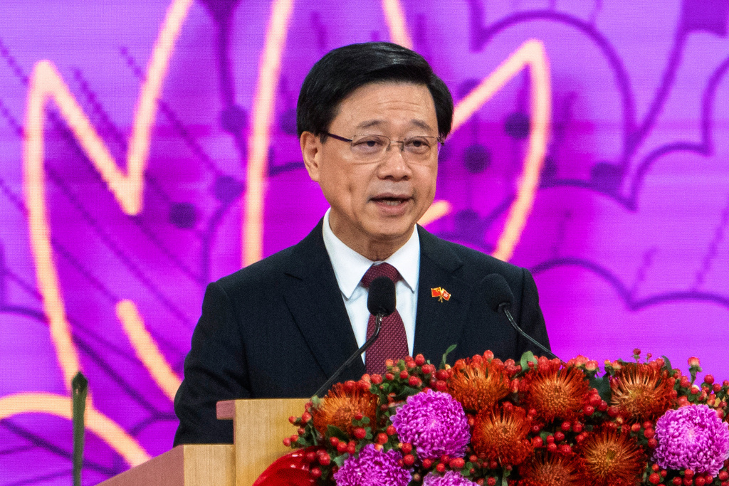 FILE - Hong Kong Chief Executive John Lee speaks at a reception following a flag raising ceremony for the celebration of 74th National Day of the People's Republic of China at the Golden Bauhinia Square in Hong Kong on Oct. 1, 2023. (AP Photo/Chan Long Hei, File)