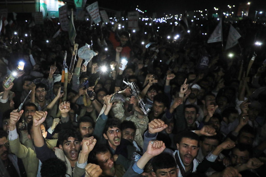 Houthi supporters shout slogans as they demonstrate against airstrikes on Sanaa International Airport in Sanaa, Yemen, Monday, July 13, 2026. (AP Photo/Osamah Abdulrahman)