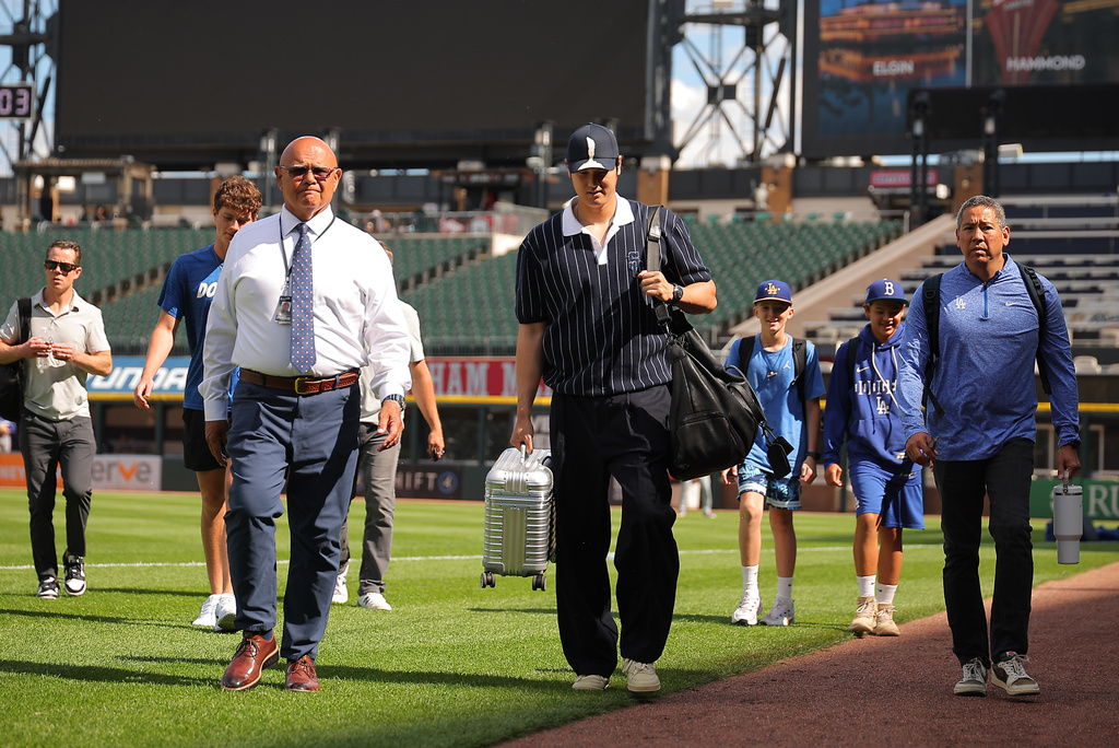 Los Angeles Dodgers' Shohei Ohtani enters the field prior to a baseball game against the Chicago White Sox, Friday, June 12, 2026, in Chicago. (AP Photo/Melissa Tamez)
