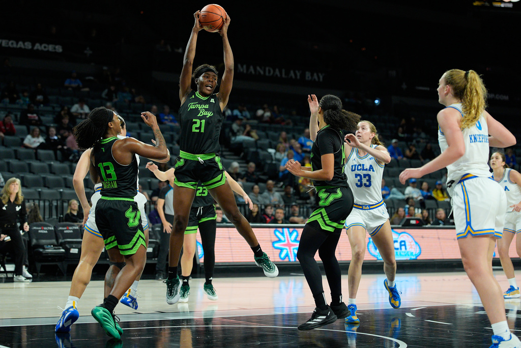 South Florida forward L'Or Mputu (21) grabs a rebound against UCLA during the first half of an NCAA college basketball game Saturday, Nov. 15, 2025, in Las Vegas. (AP Photo/John Locher)