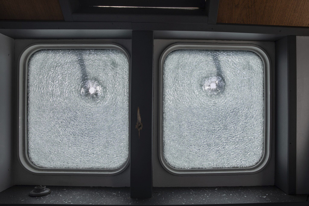 A view of bullet-drilled windows of the MV Ocean Viking, search and rescue vessel chartered by non profit group nonprofit SOS Mediterranee, which, according to the organisation, was fired on by the Libyan Coast Guard, approximately 40 Nautical Miles north of the Libyan coast, Sunday, Aug. 24, 2025. (Max Cavallari/SOS Mediterranee Via AP)