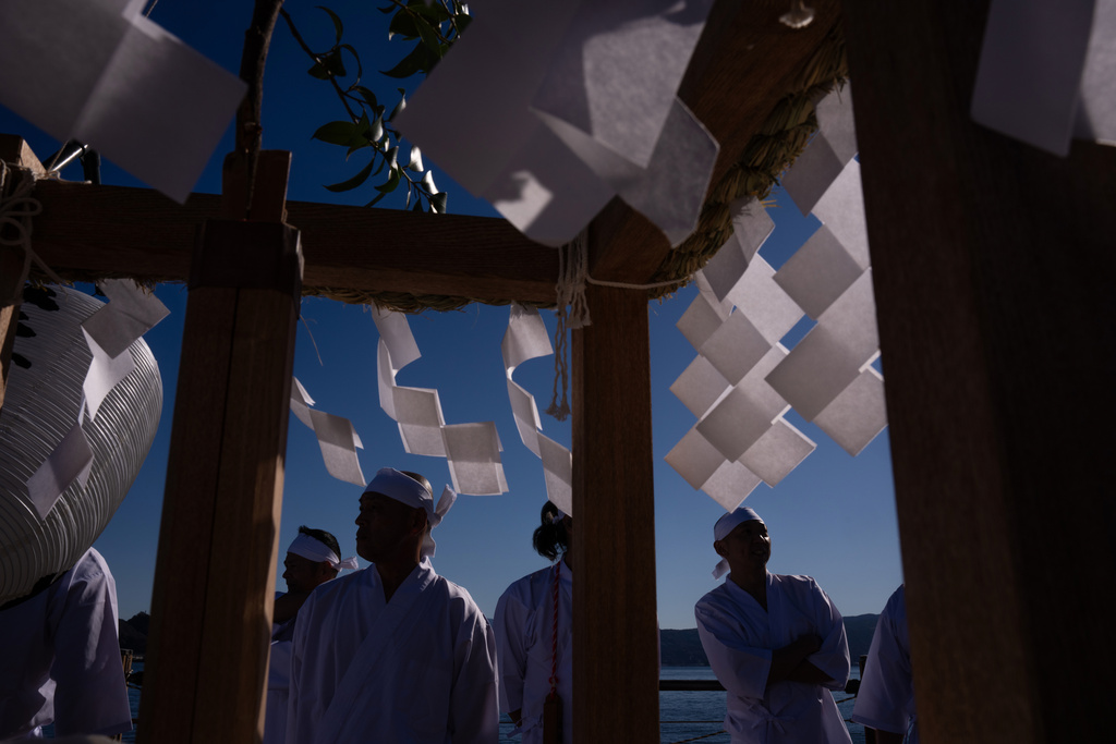 Participants prepare for the Winter Sea Misogi Festival, a Shinto purification ritual marking the New Year, in Numazu, Japan, Monday, Jan. 12, 2026. (AP Photo/Louise Delmotte)