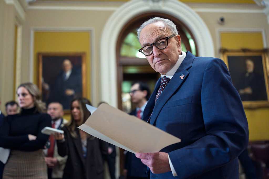 Senate Minority Leader Chuck Schumer, D-N.Y., waits to speak to reporters following a closed-door meeting with fellow Democrats on spending legislation that funds the Department of Homeland Security and a swath of other government agencies at the Capitol in Washington, Wednesday, Jan. 28, 2026. (AP Photo/J. Scott Applewhite)