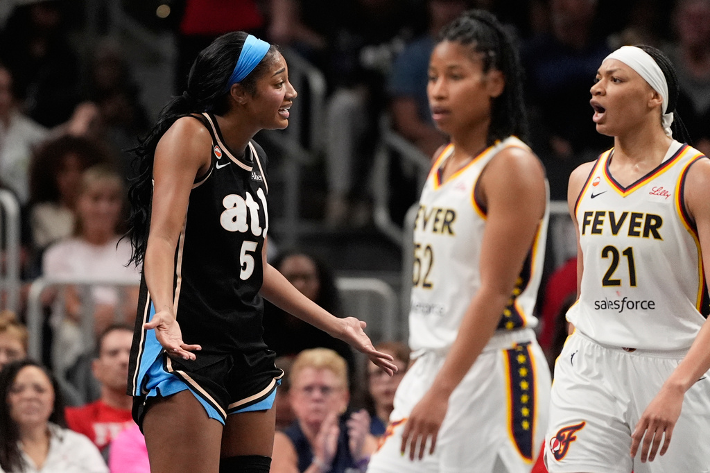 Atlanta Dream forward Angel Reese (5) reacts in the first half of an WNBA basketball game against the Indiana Fever Sunday, Aug. 16, 2026, in Atlanta. (AP Photo/Brynn Anderson)