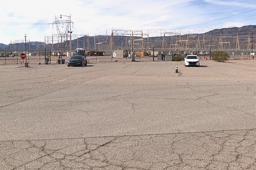 This photo provided by KTNV shows a power substation, where authorities say they are investigating a car collision, on Thursday, Feb. 19, 2026, in Boulder City, Nevada. (KTNV via AP)