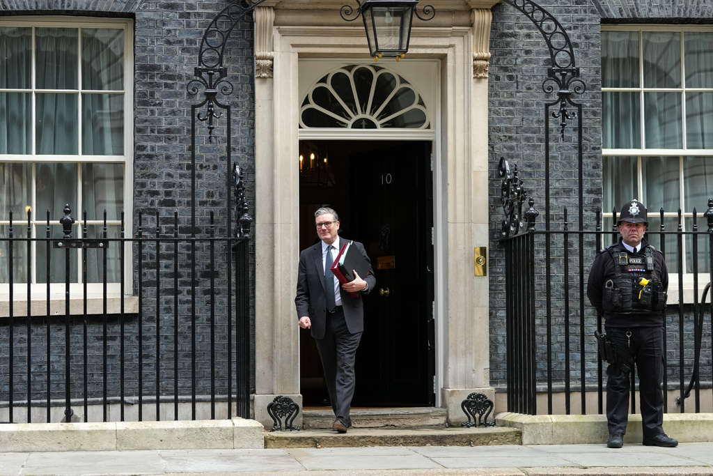 Britain's Prime Minister Keir Starmer leaves 10 Downing Street to attend the weekly Prime Ministers' Questions session in parliament in London, Wednesday, March 11, 2026. (AP Photo/Frank Augstein)