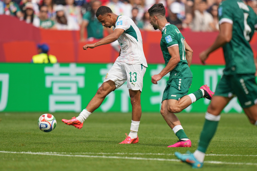 Senegal's Iliman Ndiaye (13) kicks the ball to score their fifth goal during the World Cup Group I soccer match between Senegal and Iraq in Toronto, Friday, June 26, 2026. (AP Photo/Stephanie Scarbrough)