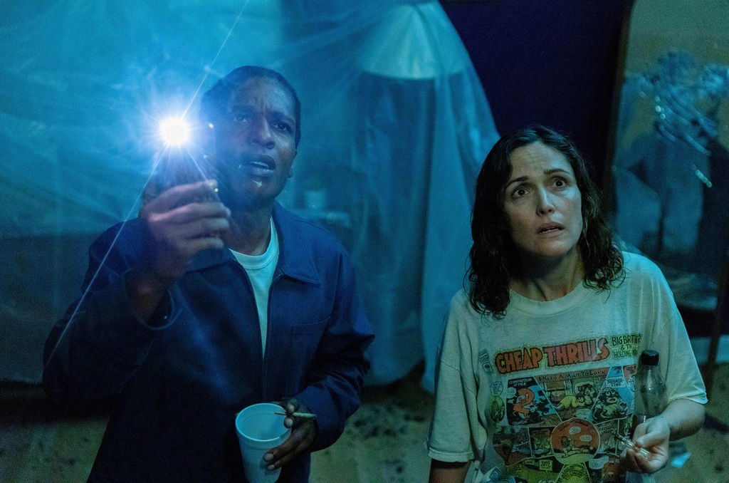 This image released by A24 shows A$AP Rocky, left, and Rose Byrne in a scene from " If I Had Legs I'd Kick You." (Logan White/A24 via AP)