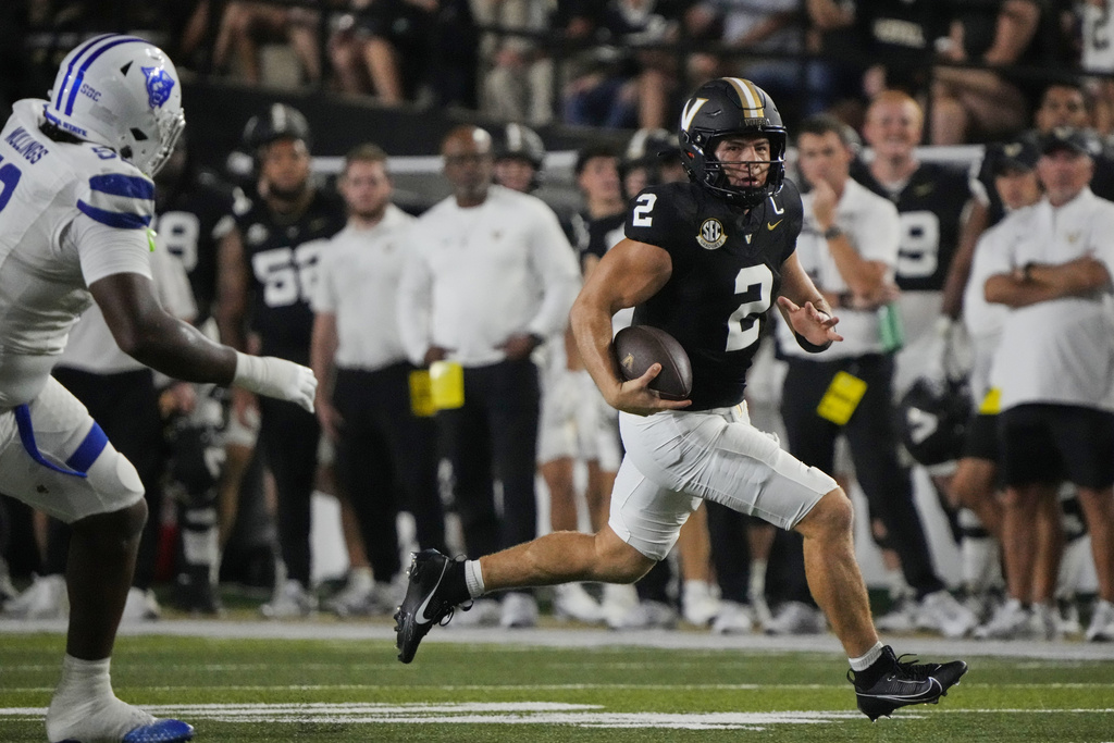 Vanderbilt quarterback Diego Pavia (2) runs for a first down during the first half of an NCAA college football game against Georgia State, Saturday, Sept. 20, 2025, in Nashville, Tenn. (AP Photo/George Walker IV)