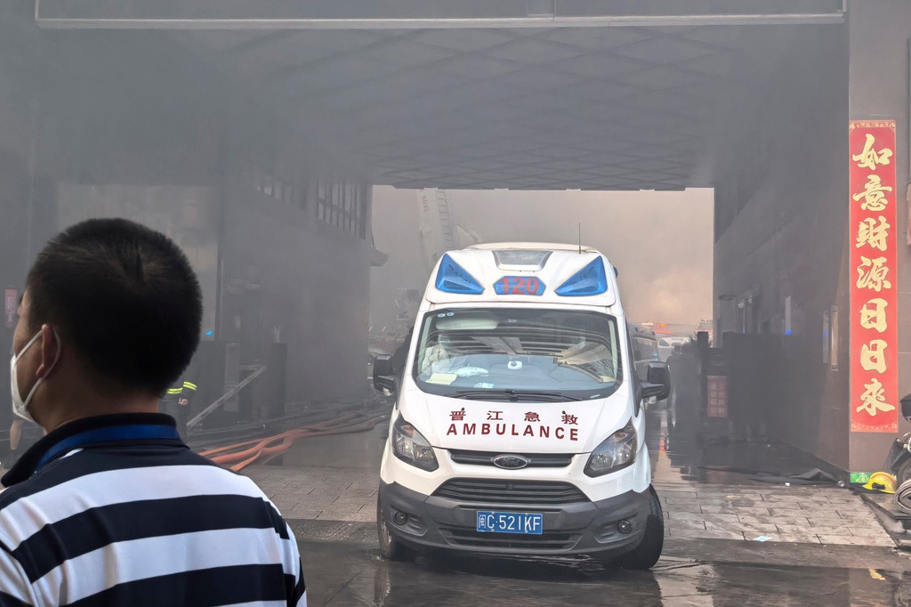 In this photo released by Xinhua News Agency, an ambulance waits at the scene of a footwear factory fire in Jiangtou village, Chendai township of Jinjiang city, southeastern China's Fujian province, Thursday, July 9, 2026. (Zheng Liang/Xinhua via AP)