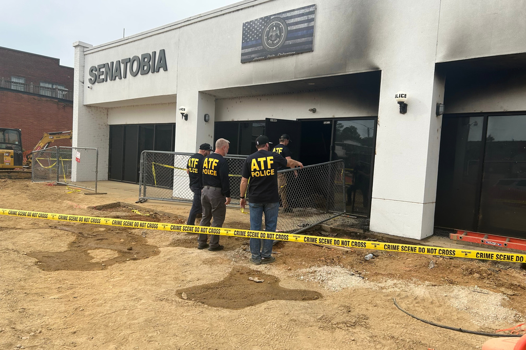 This photo provided by U.S. Bureau of Alcohol, Tobacco, Firearms and Explosives (ATF) New Orleans Field Division shows special agents from the ATF New Orleans Field Division investigate a fire at the Senatobia Police Department on Saturday, Oct. 31, 2026, in Senatobia, Miss. (ATF New Orleans Field Division via AP)