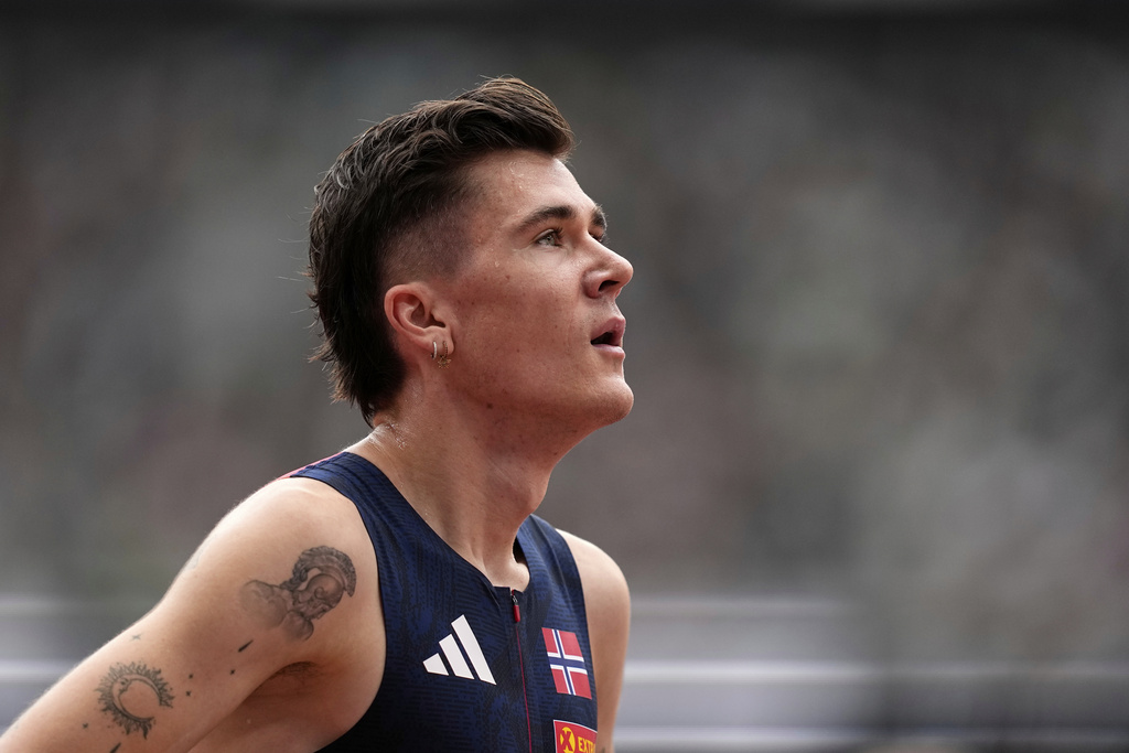 Norway's Jakob Ingebrigtsen reacts after finishing a men's 1,500 meters heat at the World Athletics Championships in Tokyo, Sunday, Sept. 14, 2025. (AP Photo/Petr David Josek)