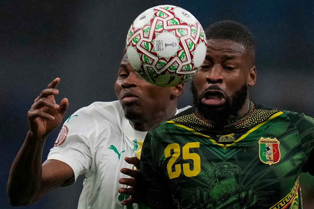 Senegal's Mouhamadou Diallo, left, and Mali's Ousmane Camara fight for the ball during the Africa Cup of Nations quarterfinal soccer match between Senegal and Mali in Tangier, Morocco, Friday, Jan. 9, 2026. (AP Photo/Themba Hadebe)