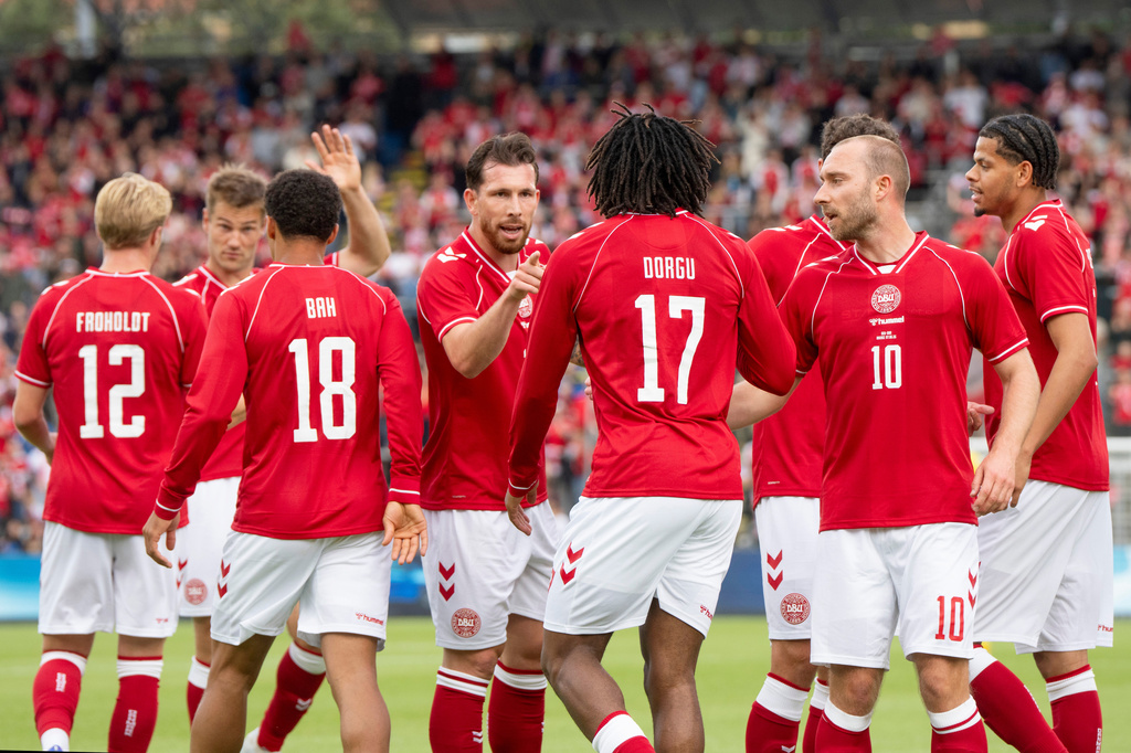 Denmark's players react after Patrick Dorgu scored against Ukraine during an international football match between Denmark and Ukraine, in Odense, Denmark, Sunday, June 7, 2026. Player Christian Eriksen (10) is second right. (Bo Amstrup/Ritzau Scanpix via AP)