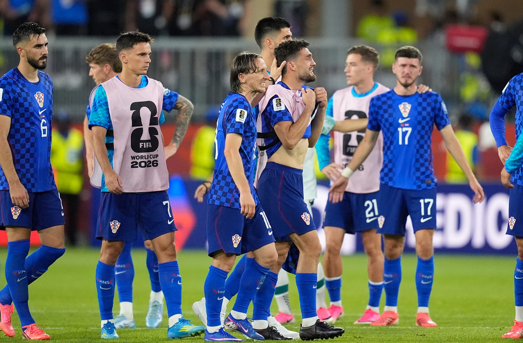 Croatia's Luka Modric (10) consoles Croatia's Mateo Kovacic (8) after a loss during the World Cup round of 32 soccer match between Portugal and Croatia in Toronto, Thursday, July 2, 2026. (AP Photo/Mike Stewart)