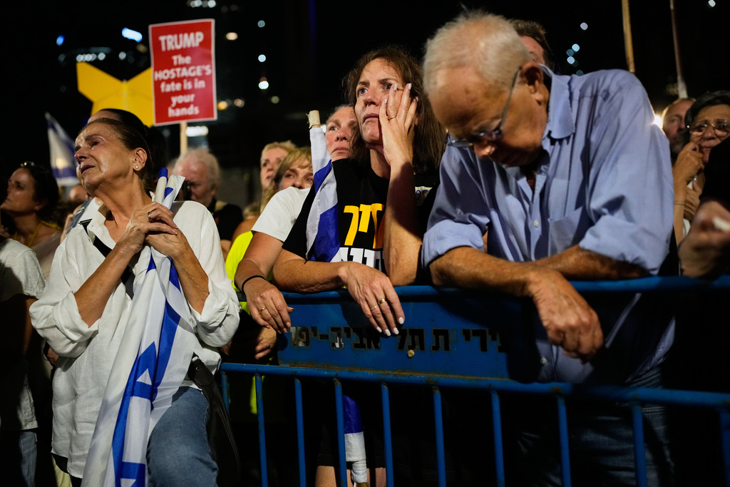 People attend a rally calling for the release of all hostages held by Hamas in the Gaza Strip and urges a ceasefire, in Tel Aviv, Israel, Saturday, Oct. 4, 2025. ahead of the second anniversary of the Israel-Hamas war. (AP Photo/Ohad Zwigenberg)