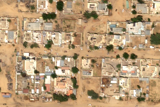 This satellite image taken by Airbus DS shows two reddish stains on the ground near what are likely Rapid Support Forces vehicles in the Daraja Oula neighborhood of el-Fasher, Sudan, Monday, Oct. 27, 2025. (Airbus DS 2025 via AP) This satellite image taken by Airbus DS shows two reddish stains on the ground near what are likely Rapid Support Forces vehicles in the Daraja Oula neighborhood of el-Fasher, Sudan, Monday, Oct. 27, 2025. (Airbus DS 2025 via AP)