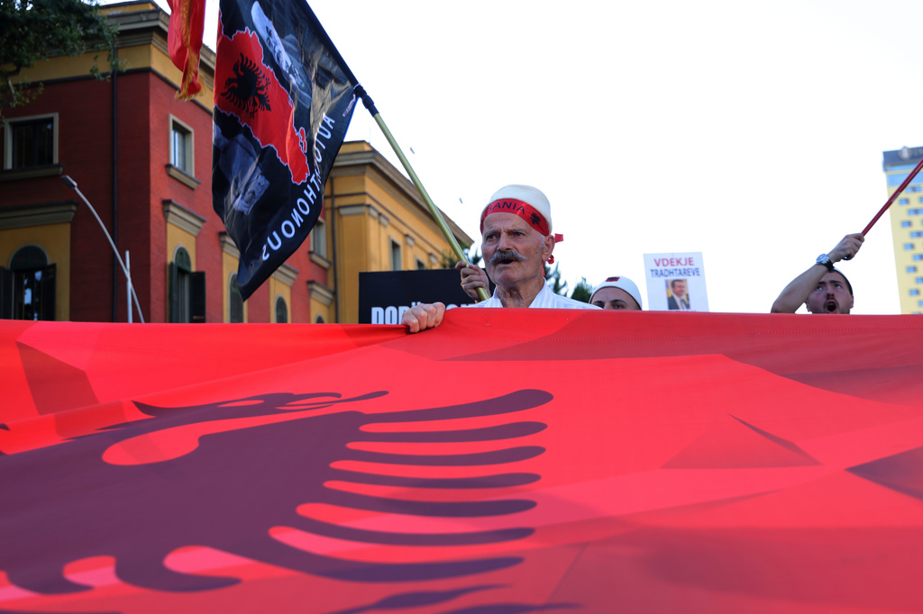 Protesters take part in a rally in Tirana, Albania, Tuesday, June 9, 2026, against the construction of a massive coastal development project linked to Jared Kushner and Ivanka Trump at Narta lagoon area, western Albania. (AP Photo/Hameraldi Agolli)