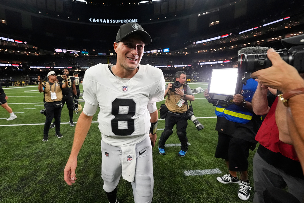 Las Vegas Raiders quarterback Kirk Cousins (8) walks off the field after the team's win an NFL football game against the New Orleans Saints in New Orleans, Sunday, Sept. 27, 2026. (AP Photo/Gerald Herbert)