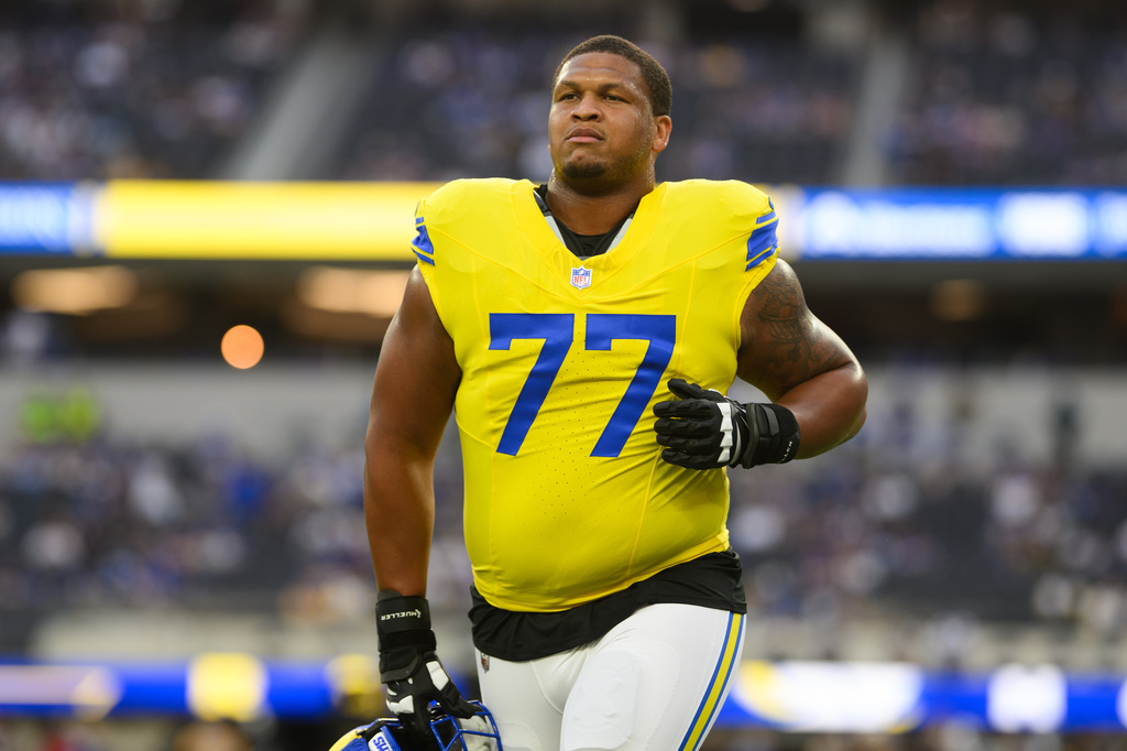 FILE - Los Angeles Rams offensive tackle Alaric Jackson (77) jogs back to the locker room before an NFL football game against the New York Giants in Inglewood, Calif., Sept. 21, 2026. (AP Photo/Kyusung Gong, File)