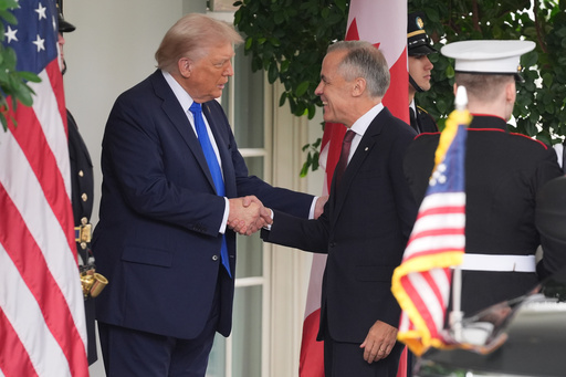 President Donald Trump greets Canadian Prime Minister Mark Carney at the White House, Tuesday, Oct. 7, 2025, in Washington. (AP Photo/Evan Vucci) President Donald Trump greets Canadian Prime Minister Mark Carney at the White House, Tuesday, Oct. 7, 2025, in Washington. (AP Photo/Evan Vucci)