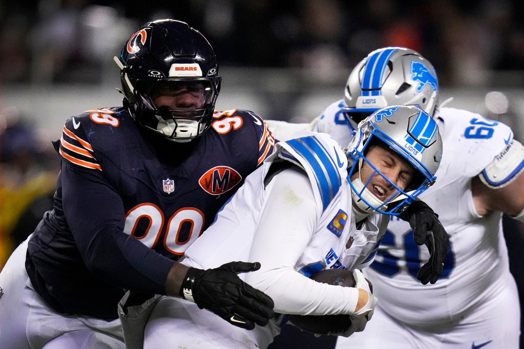 Detroit Lions quarterback Jared Goff is sacked by Chicago Bears defensive tackle Gervon Dexter Sr. (99) during the second half of an NFL football game, Sunday, Jan. 4, 2026, in Chicago. (AP Photo/Erin Hooley)