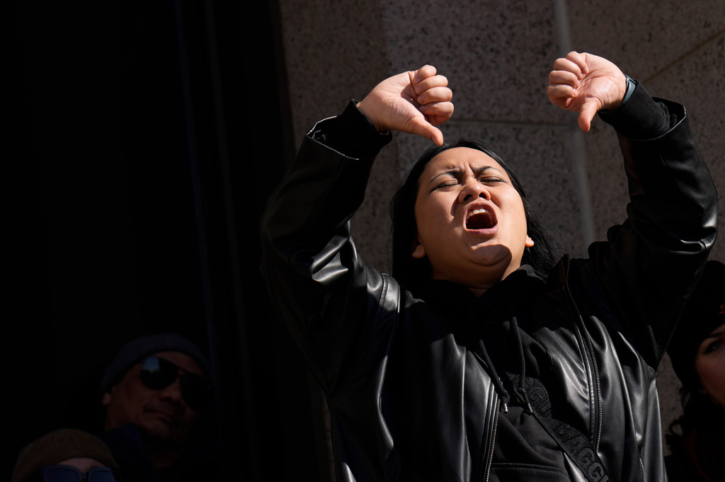 A person reacts during a "No Kings" protest Saturday, March 28, 2026, in St. Paul, Minn. (AP Photo/Joe Scheller)