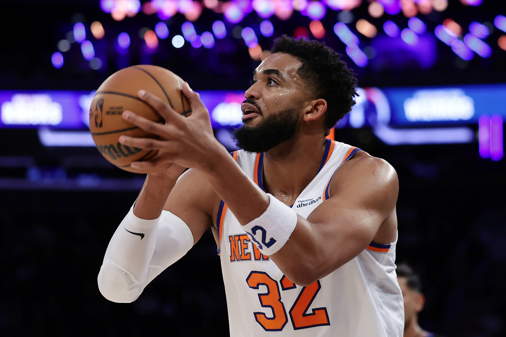New York Knicks center Karl-Anthony Towns looks to shoot during the first half of a preseason NBA basketball game against the Washington Wizards, Thursday, Oct. 8, 2026, in New York. (AP Photo/Adam Hunger)