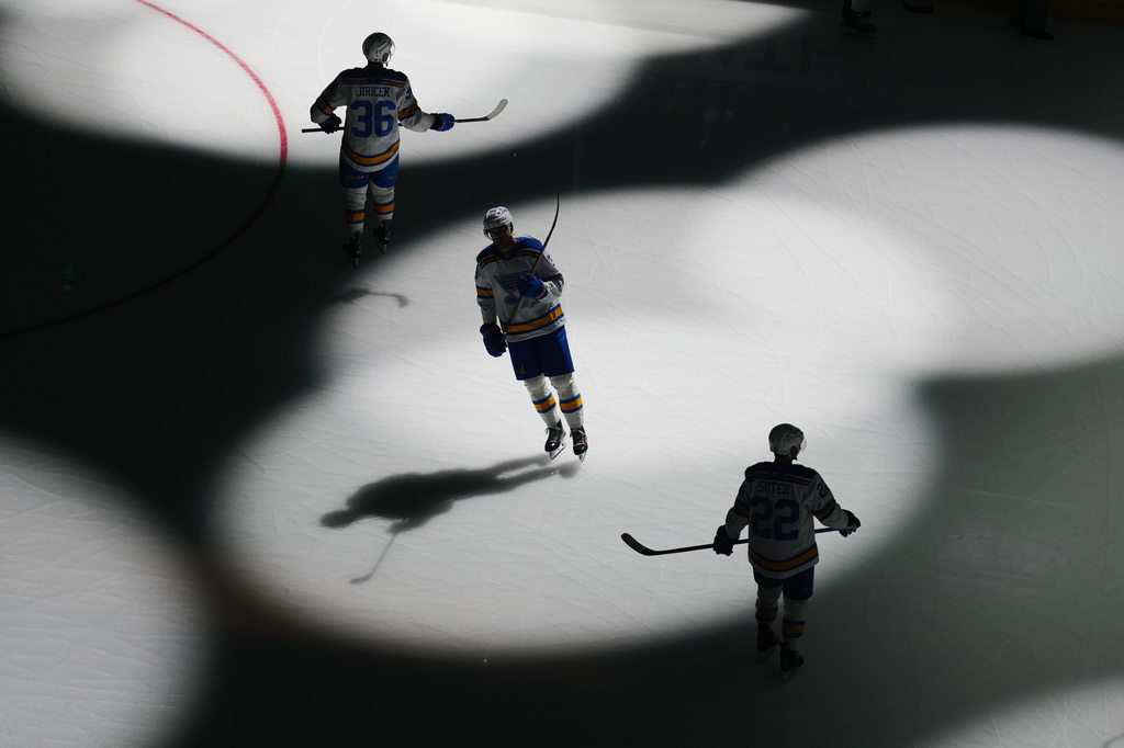 St. Louis Blues players Adam Jiricek (36), Alexey Toropchenko and Pius Suter take the ice prior to the first period of an NHL hockey game against the Dallas Stars, Friday, Oct. 2, 2026, in Dallas. (AP Photo/Julio Cortez)