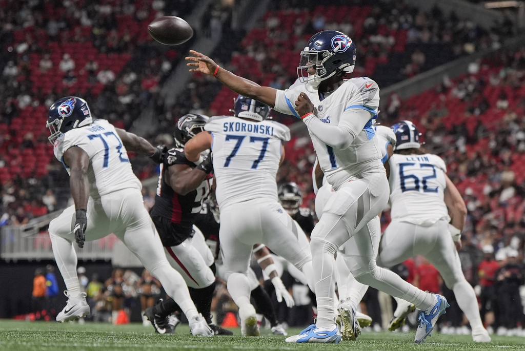 Tennessee Titans quarterback Cam Ward (1) throws a pass during the first half of a preseason NFL football game against the Atlanta Falcons, Friday, Aug. 15, 2025, in Atlanta. (AP Photo/Mike Stewart)