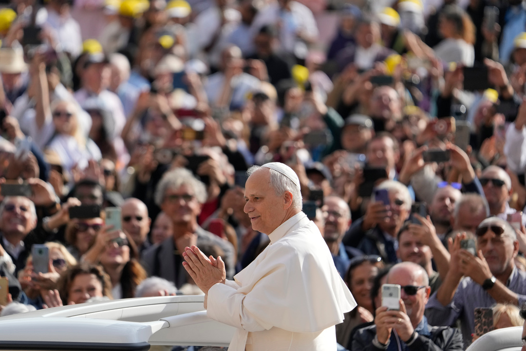 Pope Leo XIV gestures as he arrives for his weekly general audience in St. Peter's Square at The Vatican, Wednesday, Oct.1, 2025. (AP Photo/Gregorio Borgia)