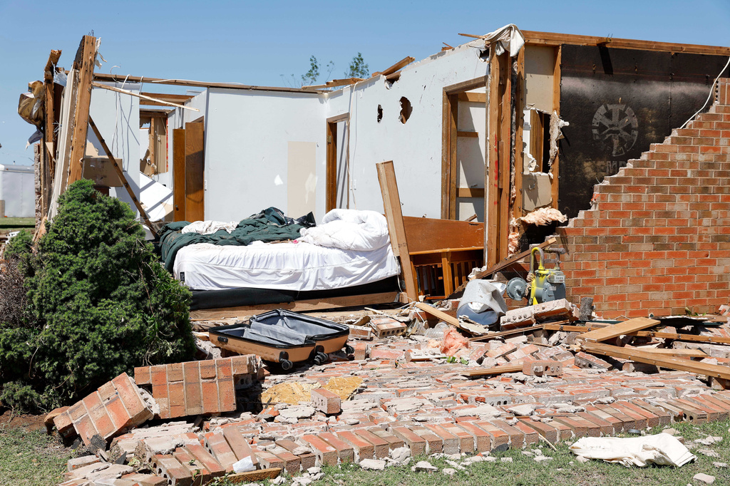 Damage is seen to a home Friday, April 24, 2026, in the Grayridge neighborhood that was damaged by a tornado Thursday in Enid, Okla. (AP Photo/Alonzo Adams)