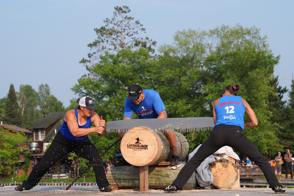 Kate Witkowski, left, and Erin Lavoie compete in the Jill and Jill event during the Lumberjack World Championships, Saturday, July 18, 2026, in Hayward, Wis. (AP Photo/Ellen Schmidt)