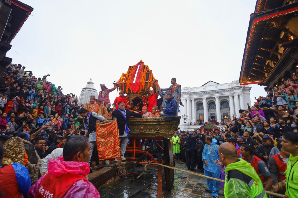 Devotees pull the chariot during Indra Jatra, a festival that marks the end of the rainy season in Kathmandu, Nepal, Friday, Sept. 25, 2026. (AP Photo/Subash Shrestha)