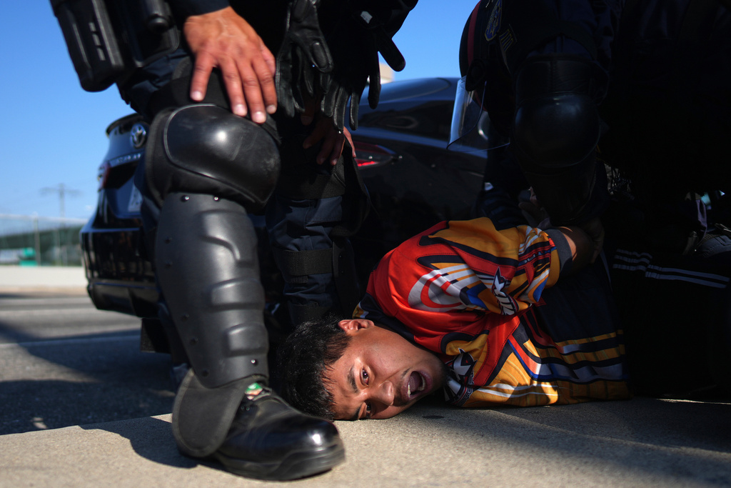 A protester is arrested by California Highway Patrol near the federal building in downtown Los Angeles, June 10, 2025. (AP Photo/Eric Thayer, File)