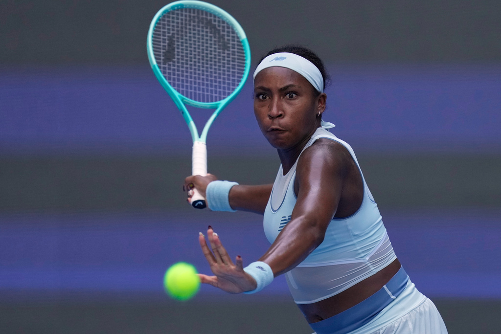 Coco Gauff of the United States plays a forehand return to Leylah Fernandez of Canada during the women's singles match for the China Open tennis tournament at the National Tennis Center in Beijing, China, Sunday, Sept. 28, 2025. (AP Photo/Mahesh Kumar A.)