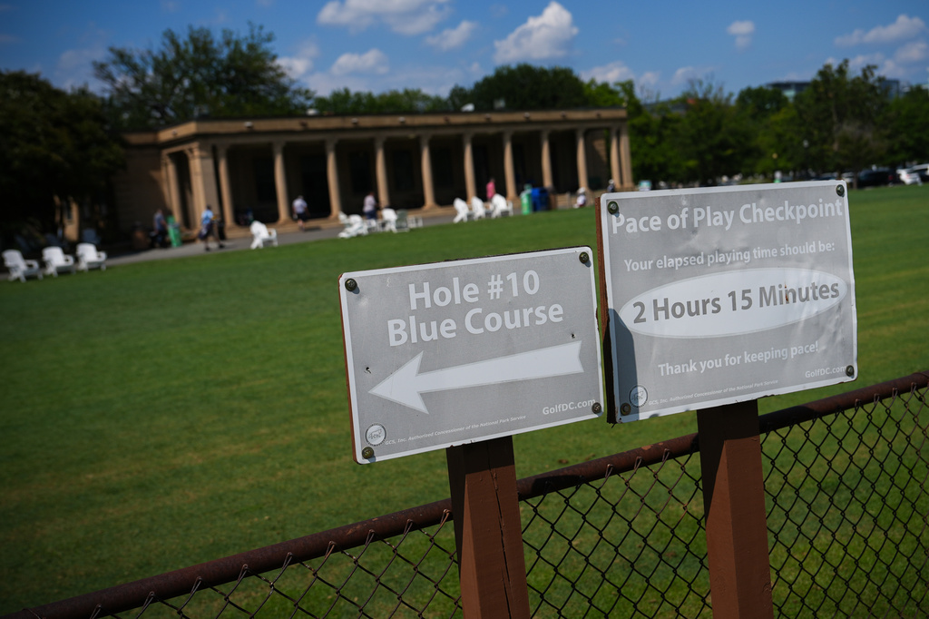 Signs are seen at East Potomac Park Golf Course, Tuesday, Sept. 1, 2026, in Washington. (AP Photo/Julia Demaree Nikhinson)