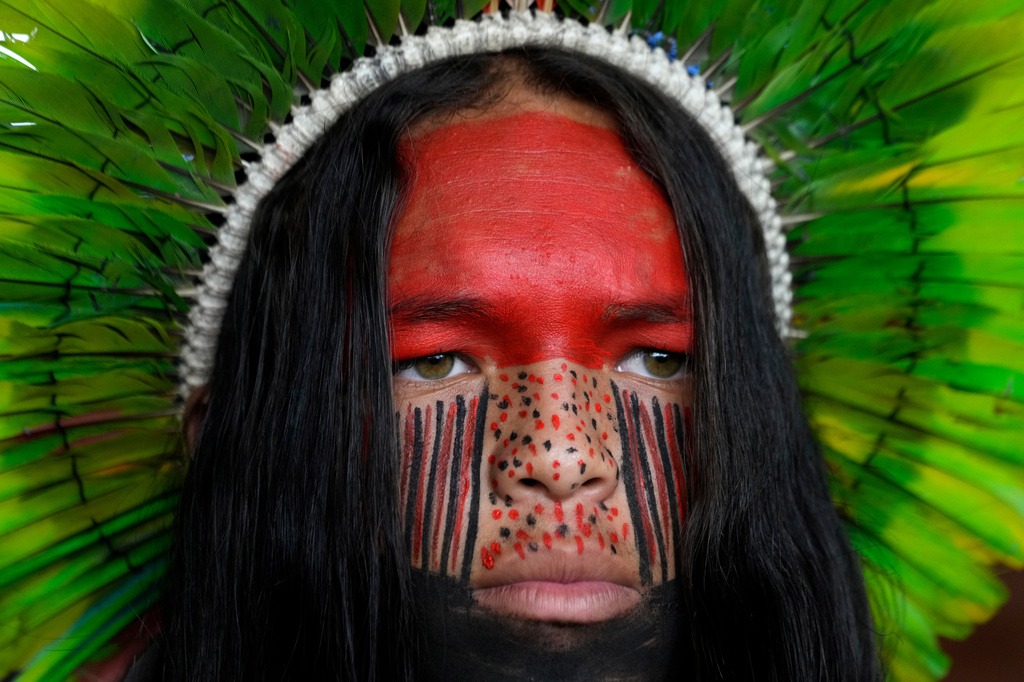 A Pataxo man looks on before a march at the Acampamento Terra Livre 2026, an Indigenous mobilization focused on land rights and environmental protection, in Brasilia, Brazil, Thursday, April 9, 2026. (AP Photo/Eraldo Peres)