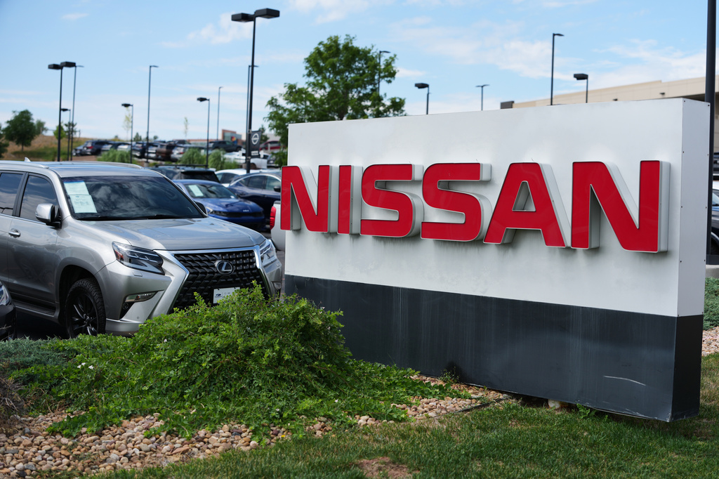 FILE - Sign carrying the corporate logo stands outside a Nissan dealership Monday, July 27, 2026, in Highlands Ranch, Colo. (AP Photo/David Zalubowski, file)